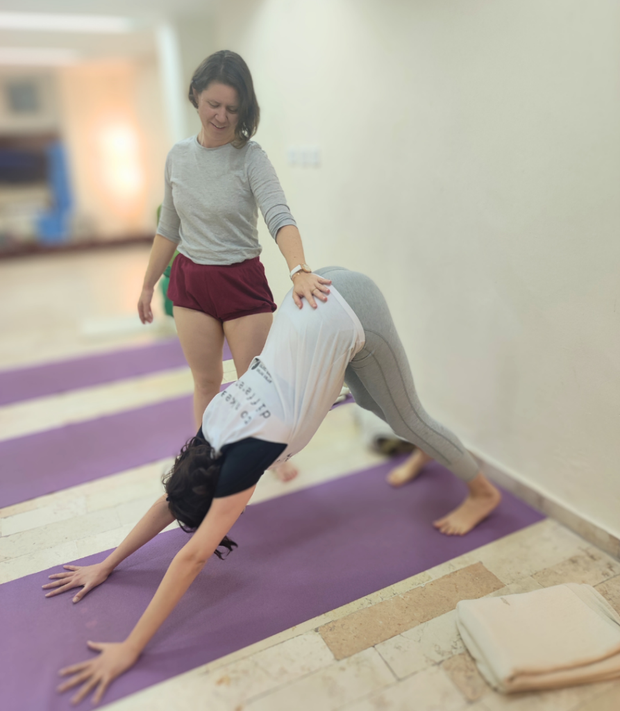 adjustment in Adho Mukha Svanasana Iyenar yoga with Agi